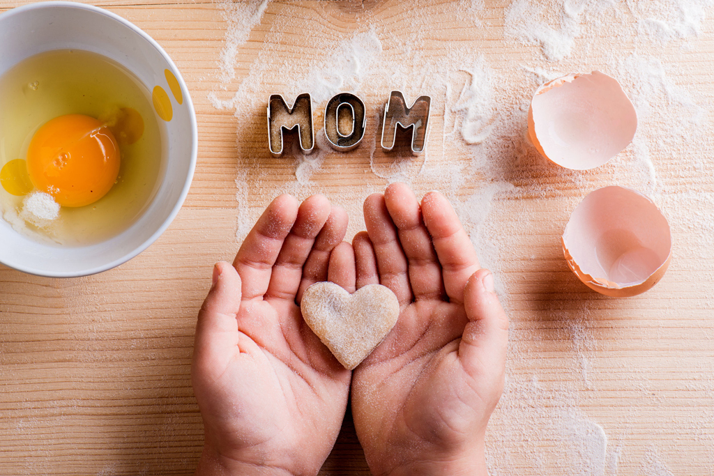 Mothers day. Heart cookie, baking, cookie cutters. Wooden backgr